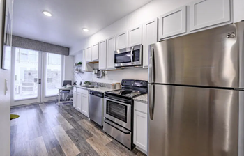 Stainless steel kitchen appliance package with microwave, stove, fridge, w/d, d/w